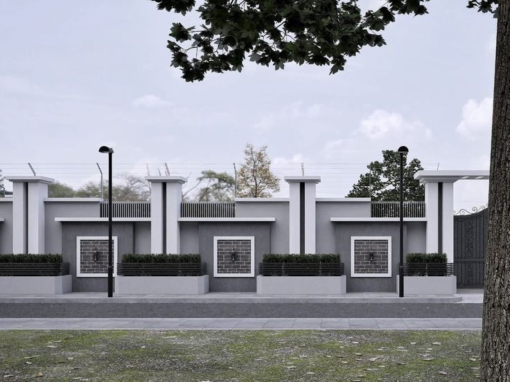 Modern grey fence with pillars, planters, brick panels and wall lights